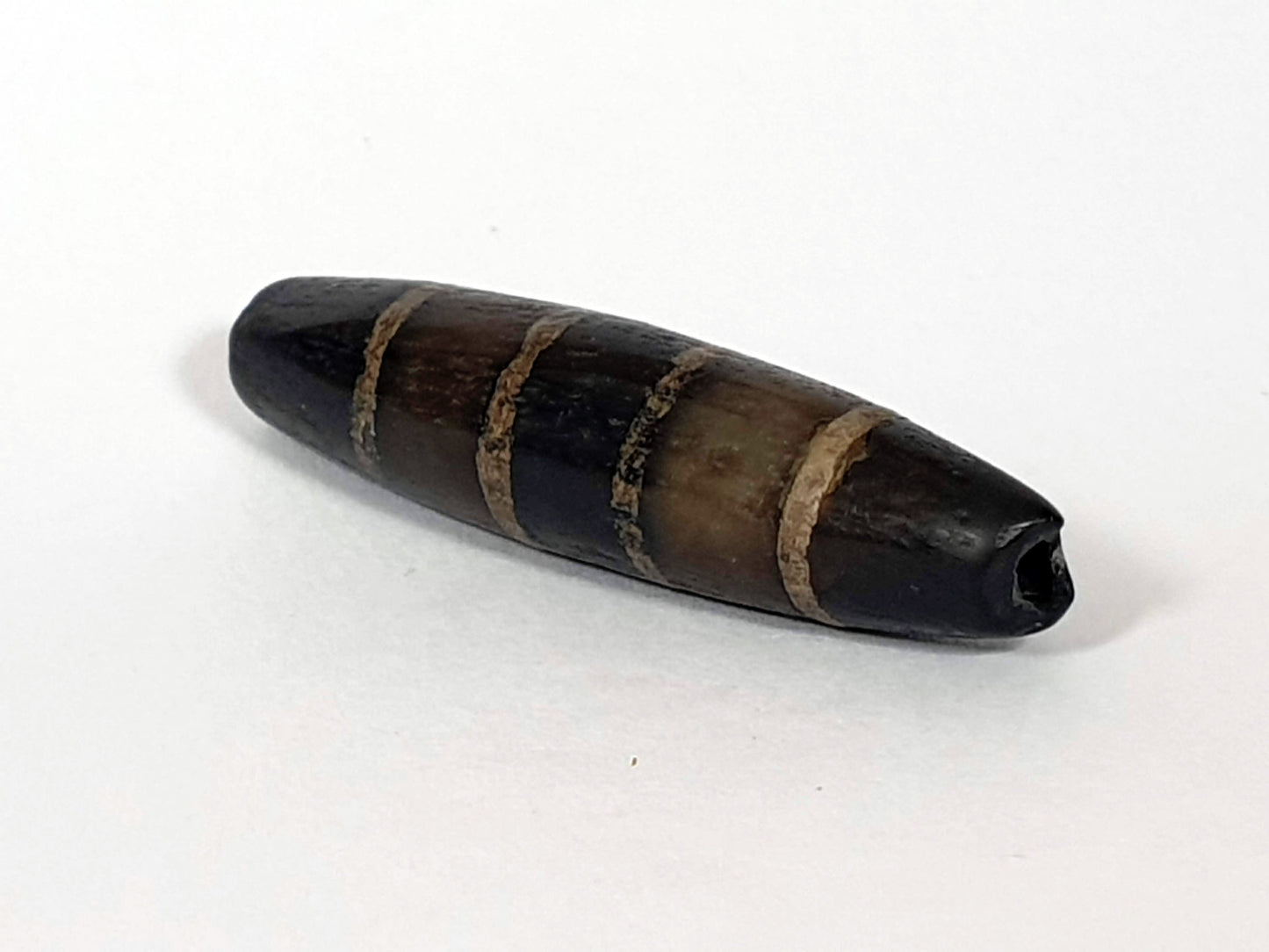 Ac-081020-7SChung ancient seven stripe Chung dzi, right end, ancient enlarged drill hole, near-pitch-black tip, unretouched