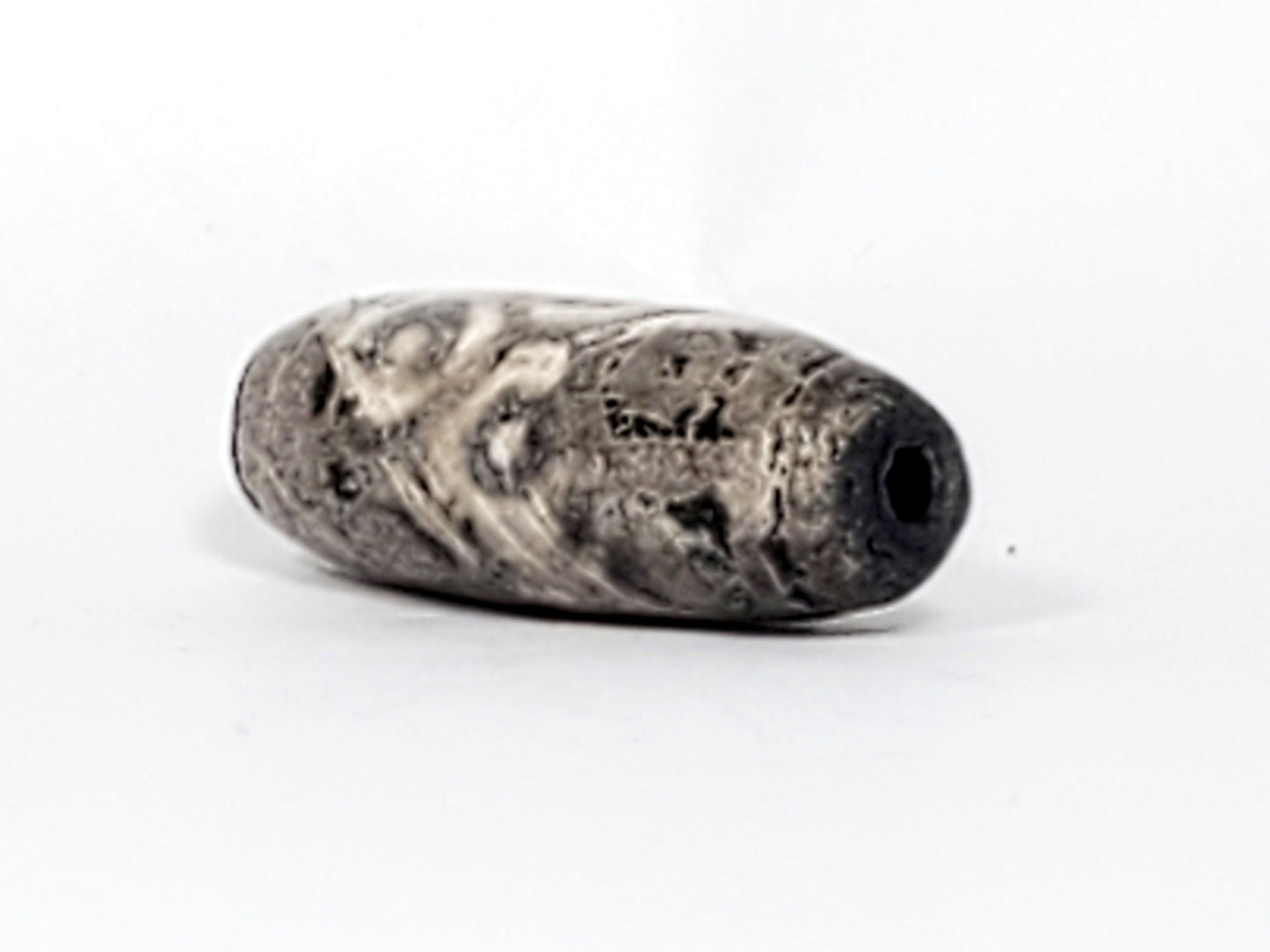 Ac-071026-12EL ancient twelve eye lotus dzi angled drill end A pitch-black interior clean hole unretouched