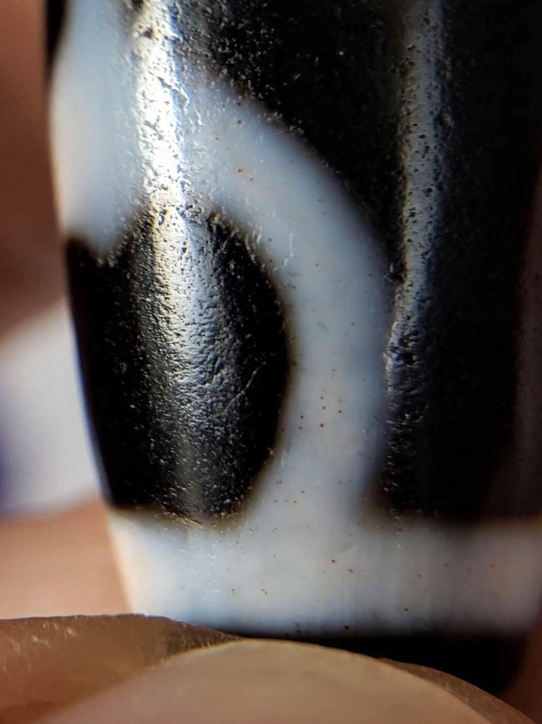 V-092224-TrVBS dzi bead, macro close-up of cinnabar inclusions within white motif line, unretouched.
Compliance Check
Item Status
Trust badge x2 + photo line ✅
Unretouched disclosure at opening ✅
Opening hook unique ✅ (new; plain V- not exempt)
SEO title ≤67 ✅ (64)
Meta ≤150 ✅ (126)
Alt texts ≤125 each ✅
Product ID in title/slug/alt ✅ V-092224-TrVBS
Spec block bold labels ✅
Bloodspot tier justified ✅ Tier 3, macro-documented, full section
-BS suffix placement ✅ suffix, not prefix
Collection links (from live