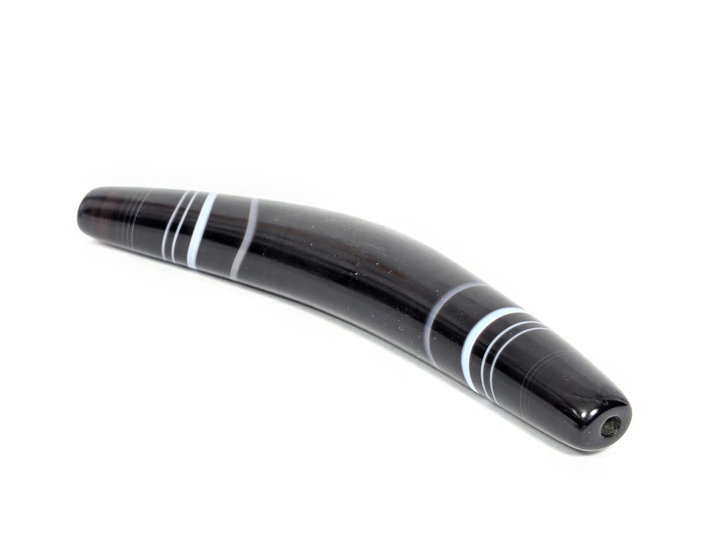At-N-071126-BOW three-quarter view, narrow tapered drill-hole end, warm agate undertone visible, unretouched