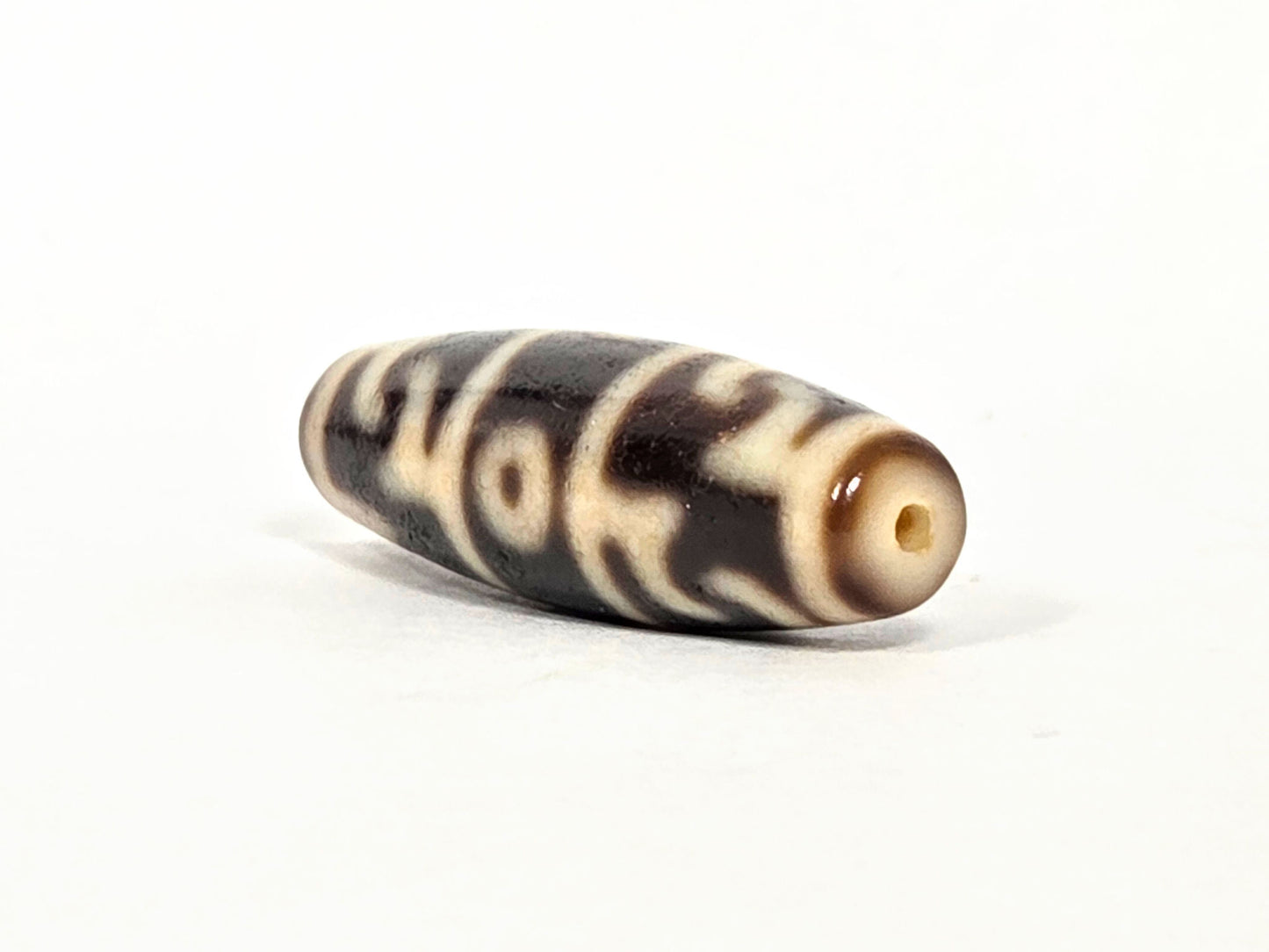 Three Eye Guru Rinpoche Paraphernalia At-071426-3EGRP 37.6×12.0mm, end angle A — cream end cap, drill opening, unretouched.