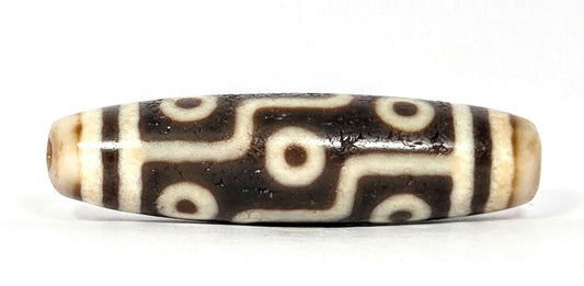 Authentic antique Nine Eye Dzi bead from Ancient Dzi Shop — most powerful dzi motif, aligned with Blue Tara's supreme protective energy