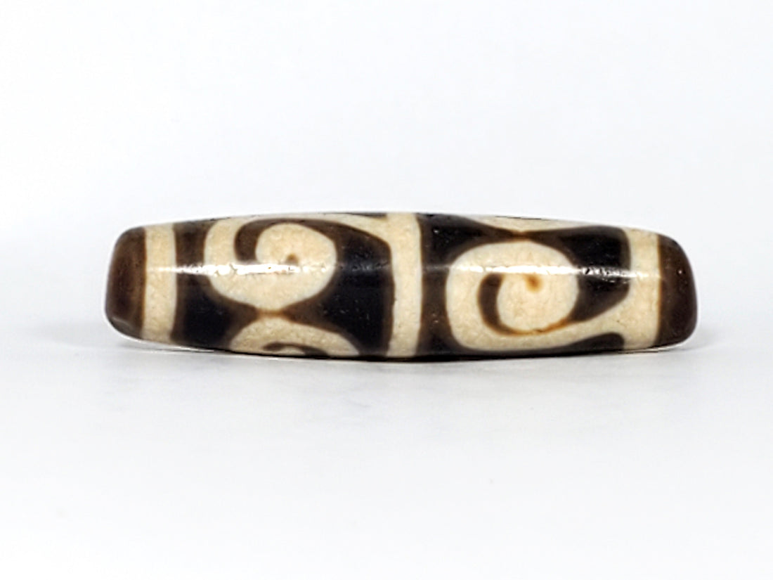 Ancient Tibetan Green Tara dzi bead motif on natural agate — authentic and unretouched