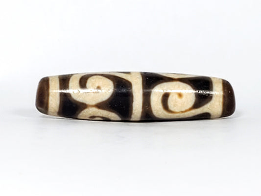 Ancient Tibetan Green Tara dzi bead motif on natural agate — authentic and unretouched