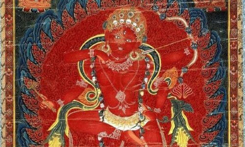 Antique Tibetan thangka depicting Red Tara (Kurukulla), fierce goddess of power and magnetism, seated in dynamic pose surrounded by fire mandorla, gold ornaments and jewels visible, traditional Buddhist iconography — Ancient Dzi Shop