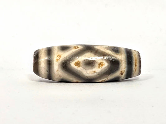 Ancient Tibetan dzi bead, three diamond eye tiger tooth motif, cream agate with dark etching and cinnabar bloodspots, Ancient Dzi Shop