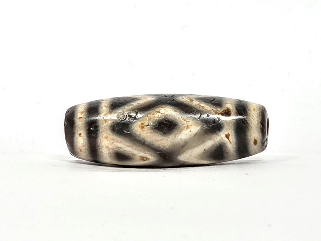 Ancient Tibetan dzi with diamond eye and tiger tooth motif, pale cream and dark charcoal agate, Type II Tibetan etching, extreme age patina, Ancient Dzi Shop