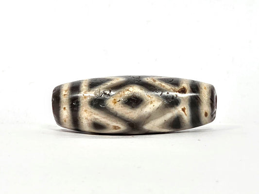 Ancient Tibetan dzi with diamond eye and tiger tooth motif, pale cream and dark charcoal agate, Type II Tibetan etching, extreme age patina, Ancient Dzi Shop