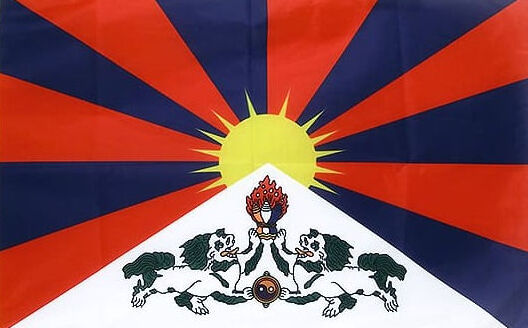 Tibetan flag with snow lions and rising sun — symbol of Tibetan culture, heritage and the ancient traditions that gave birth to dzi beads