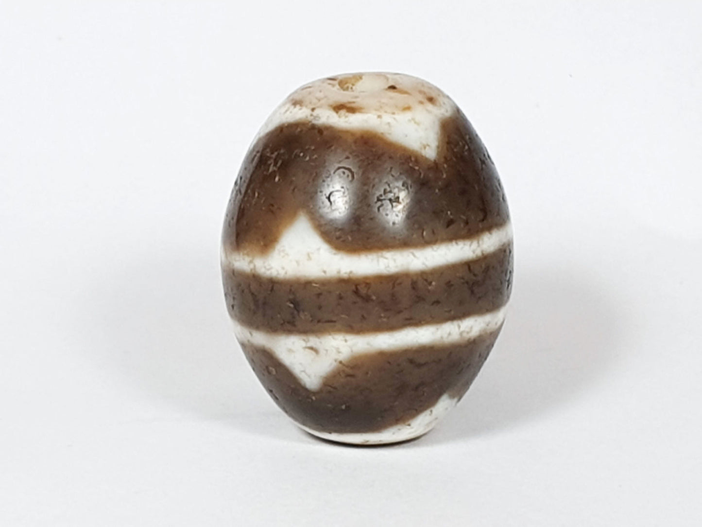 V-062926-TT third rotation, dark upper zone with cream horizontal bands, vintage round tiger tooth agate, unretouched