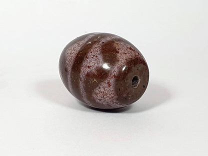 N-062926-TTBS2 Bead B, front face with drill hole, cream-lavender ground ovoid agate, tiger tooth motif, bloodspots, unretouched