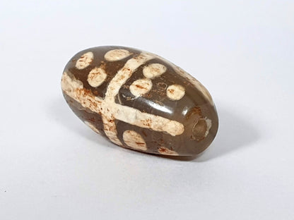 Ac-062426-18S Bead A medium warm brown ground star dots cross divider rust-brown mineral staining unretouched