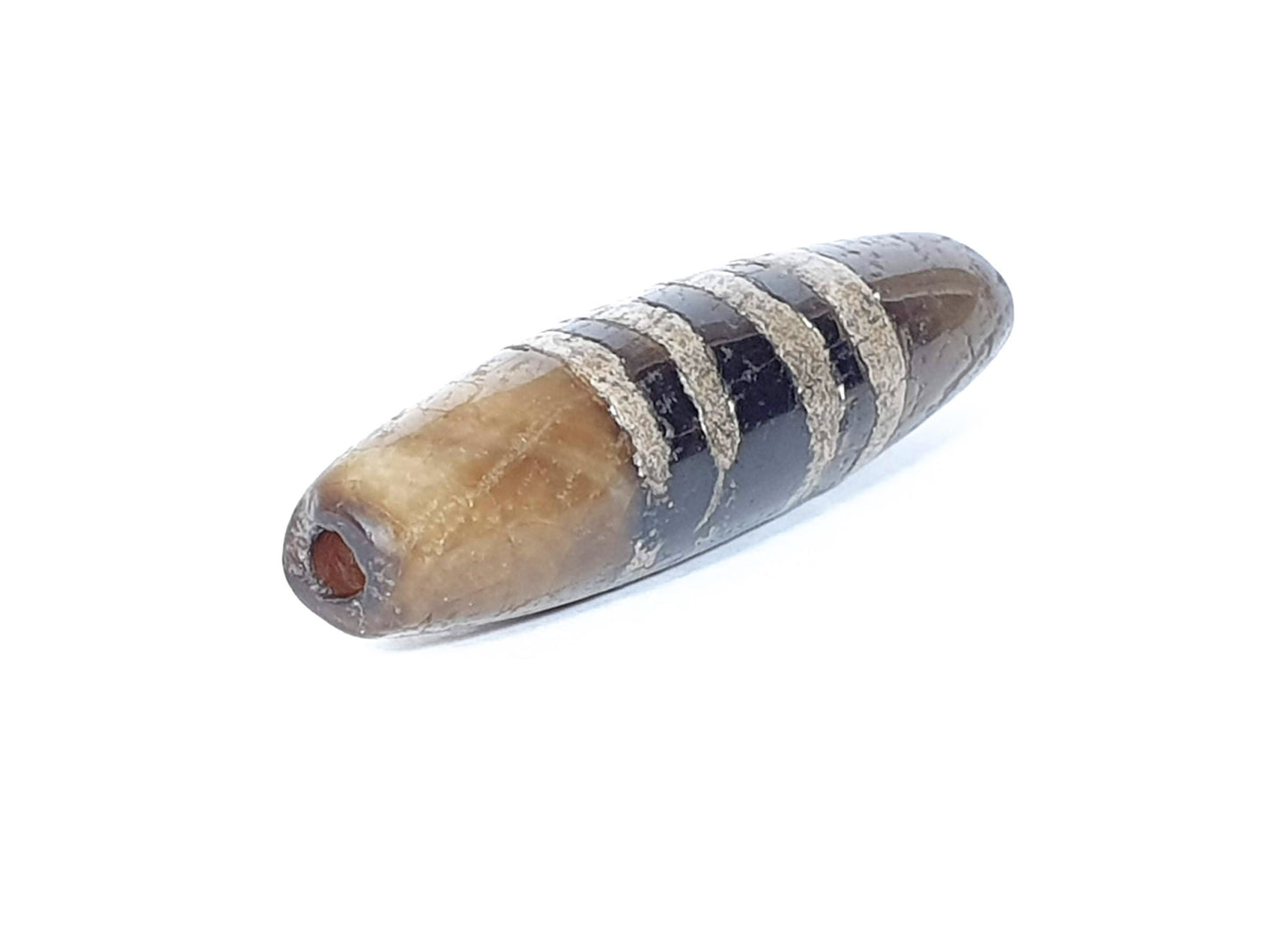 Ac-041320-7SChung ancient Chung dzi, left end, ancient drill hole with warm interior, moderate tip damage, unretouched