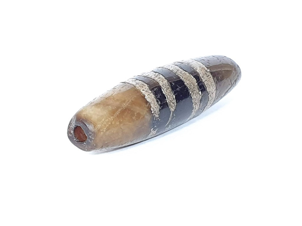 Ac-041320-7SChung ancient Chung dzi, left end, ancient drill hole with warm interior, moderate tip damage, unretouched