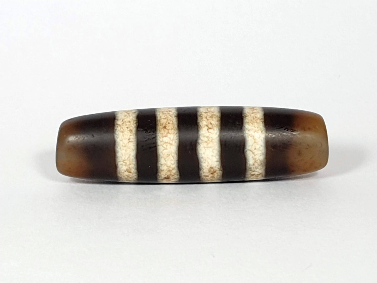 At-061920-7SChung antique seven stripe Chung dzi, 40.7×11.4mm, Face A, honey-brown ground, cream bands, unretouched