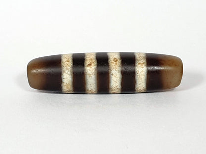 At-061920-7SChung antique seven stripe Chung dzi, Face B, translucent honey-brown end caps, warm ground, unretouched