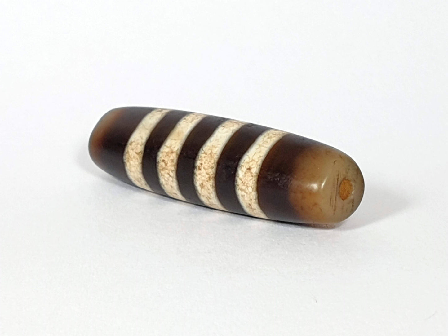 At-061920-7SChung antique seven stripe Chung dzi, right end, honey-brown cap, warm orange drill interior, unretouched