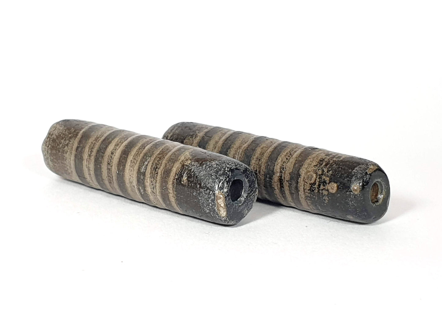 Ac-080420-19SChung, pair ancient 19 stripe Chung dzi 46.4×11.8 & 46.9×11.6mm, encrusted end faces, drill holes, unretouched