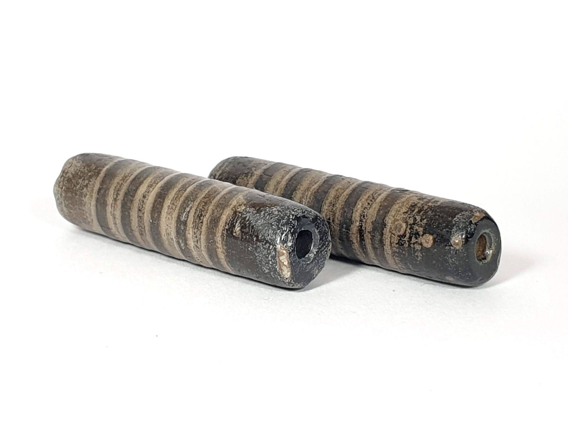 Ac-080420-19SChung, pair ancient 19 stripe Chung dzi 46.4×11.8 & 46.9×11.6mm, encrusted end faces, drill holes, unretouched