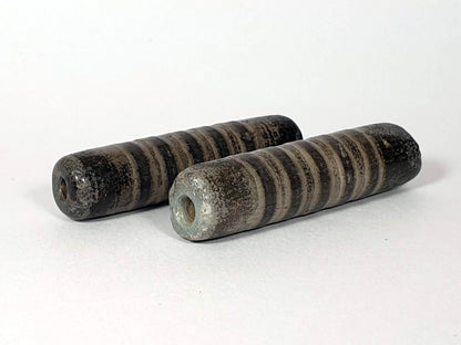 Ac-080420-19SChung, pair both beads, Bead A blue-green burial mineral deposit around drill hole, heavily weathered, unretouched