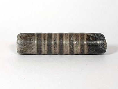 Ac-080420-19SChung, Bead A lateral, 19 narrow stripe bands on dark grey-brown ground, matte weathered surface, unretouched