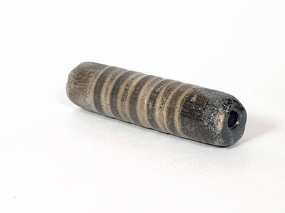 Ac-080420-19SChung, Bead A right end, large ancient drill hole with mineral deposit, encrusted end cap, unretouched