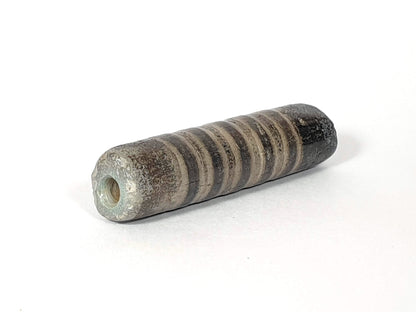 Ac-080420-19SChung, Bead A left end, blue-green burial mineral crust at drill hole, ancient cylindrical body, unretouched