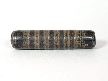 Ac-080420-19SChung, Bead B lateral, 19 stripe bands visible, matte pervasive weathering, white mineral spot disclosed, unretouched