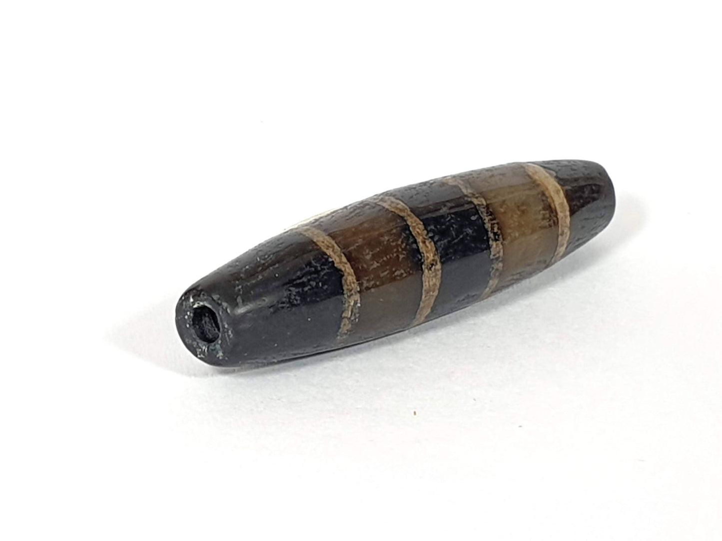 Ac-081020-7SChung ancient seven stripe Chung dzi, left end drill hole, pointed fusiform taper, golden-tan bands, unretouched