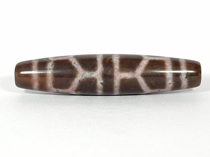N-062226-DLBS, double longevity agate dzi, 58.1×13.1mm, warm brown, dusty rose-cream cell grid, face A, unretouched