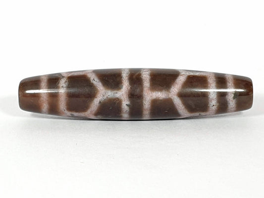 N-062226-DLBS, double longevity agate dzi, 58.1×13.1mm, warm brown, dusty rose-cream cell grid, face A, unretouched