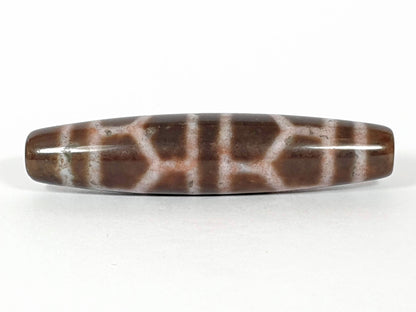 N-062226-DLBS, face B, double longevity cell grid, warm medium-dark brown ground, dusty rose-cream lines, unretouched