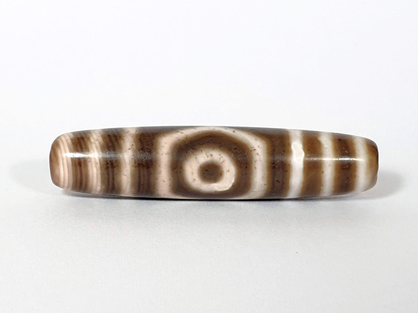 Qing Dynasty three eye dzi — front face, round eye centred, cream-brown banded agate, At-0426-3EQ