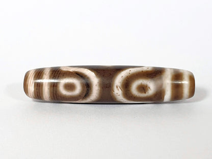 Qing Dynasty three eye dzi — reverse face, two oval eyes side by side, cream-brown agate, bracket right, At-0426-3EQ