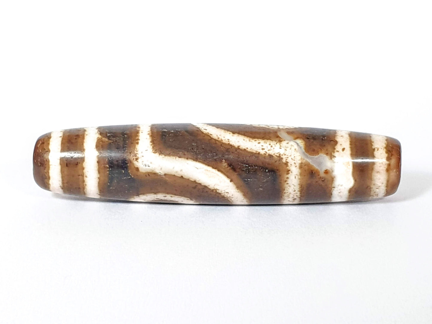 Qing Dynasty two eye dzi — reverse face, angular wave connector lines on dark brown-black ground, cream zones, At-0426-2EQ