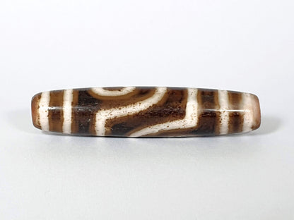 Qing Dynasty two eye dzi — fourth face, angular connector pattern, cream-dominant ground, agate banding visible, At-0426-2EQ