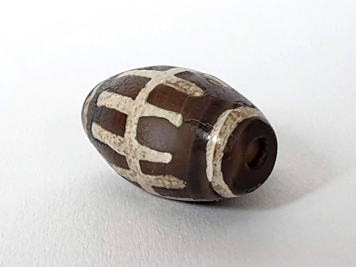Ac-062426-SR Bead B deep dark warm brown ground raised cream sun ray bars end view drill hole unretouched
