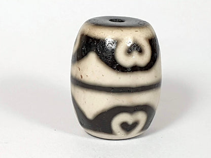 N-062226-TTSEL, upright face B, cream-ground barrel, scroll eye upper zone, heart tooth lower zone, dark brown, unretouched