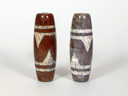 N-062426-TTBS new tiger tooth dzi pair 39.4x13.6mm warm reddish-brown and cool blue-grey ground contrast unretouched