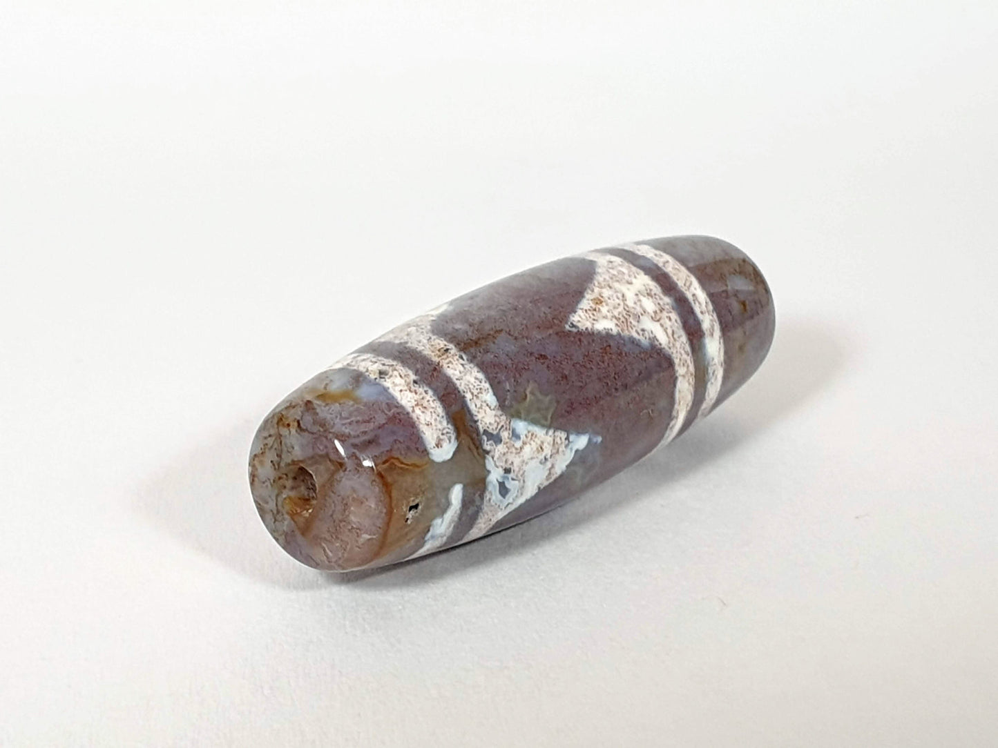 N-062426-TTBS Bead B tiger tooth dzi 39.5x13.7mm opposite end cool grey-brown drill hole natural agate variation unretouched