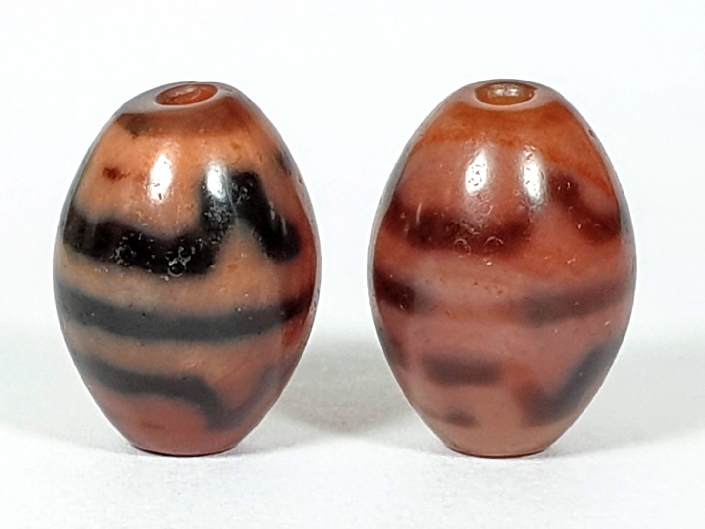 At-062926-TTBS pair second rotation, Bead A sharper bands left, Bead B diffuse bands right, terracotta agate, unretouched