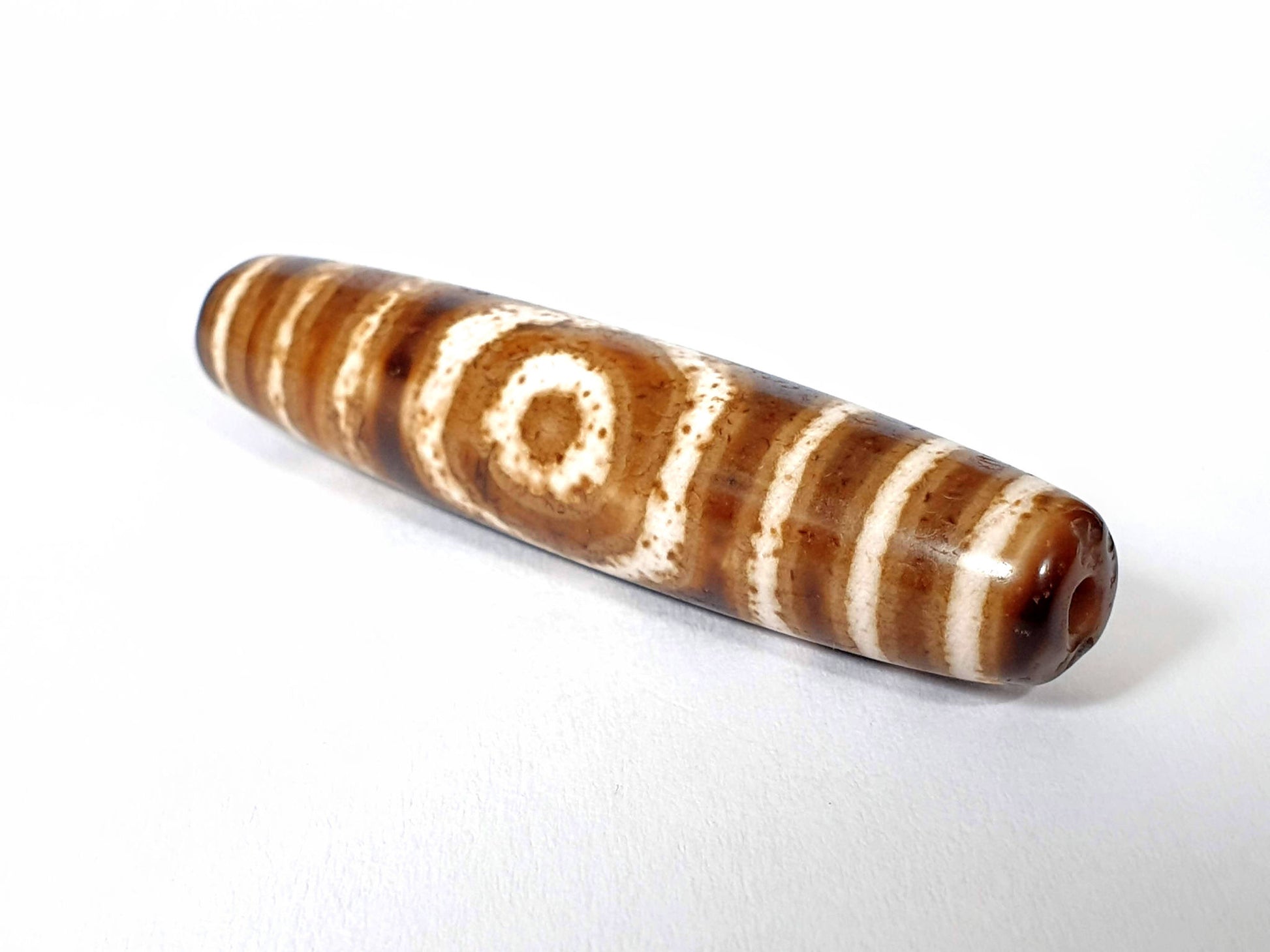 Qing Dynasty three eye dzi — opposite end, drill hole with orange-red centre at tip, one eye on body, At-0426-3EQ2