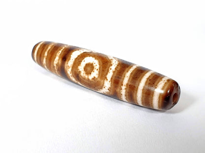 Qing Dynasty three eye dzi — opposite end, drill hole with orange-red centre at tip, one eye on body, At-0426-3EQ2