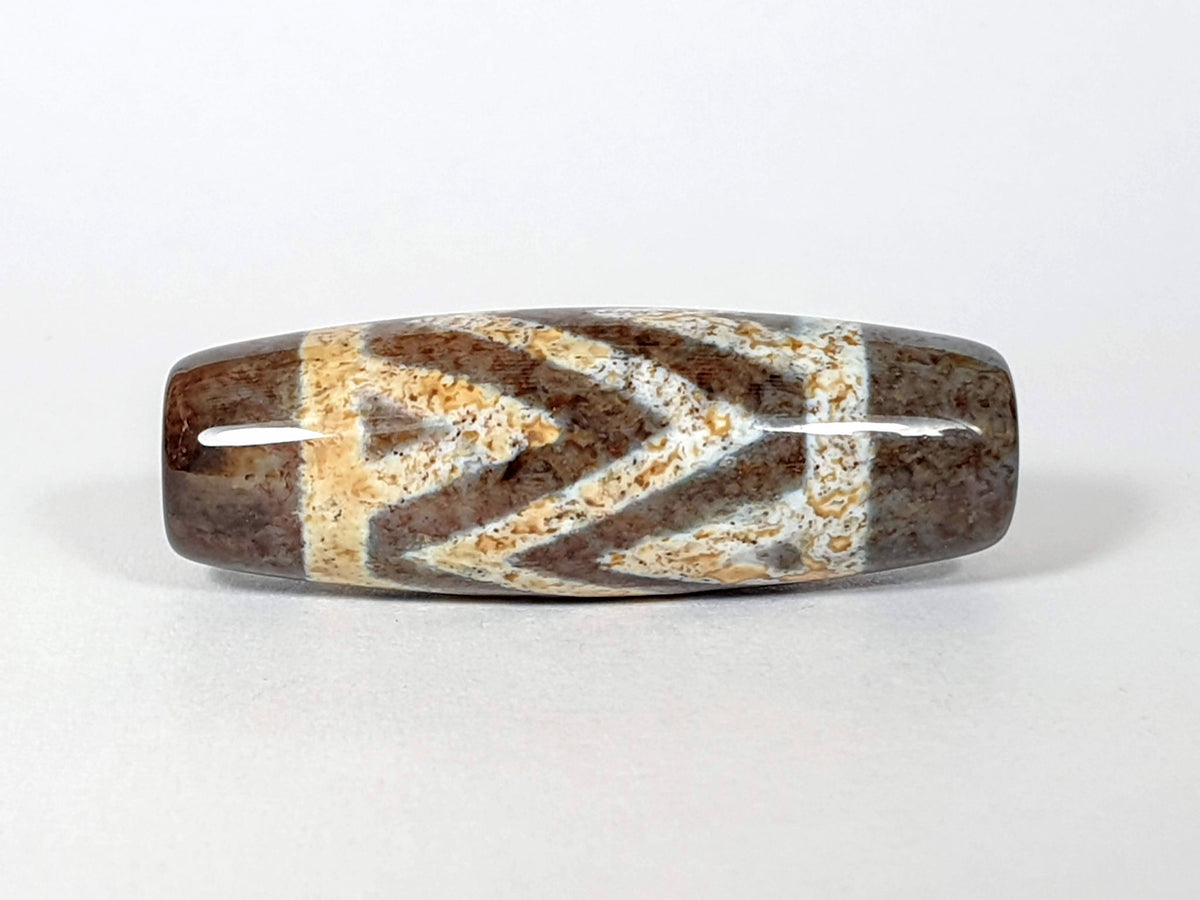 N-062426-3TSBS Bead A three stripe tiger dzi 39.7x13.8mm opposite end honey-gold warm motif drill hole unretouched