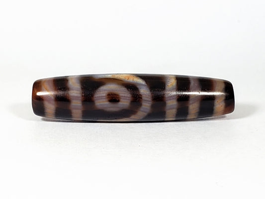 At-041521-2EBS face A near-closed eye honey-golden-orange motif deep near-black 49.1x11.8mm dzi unretouched