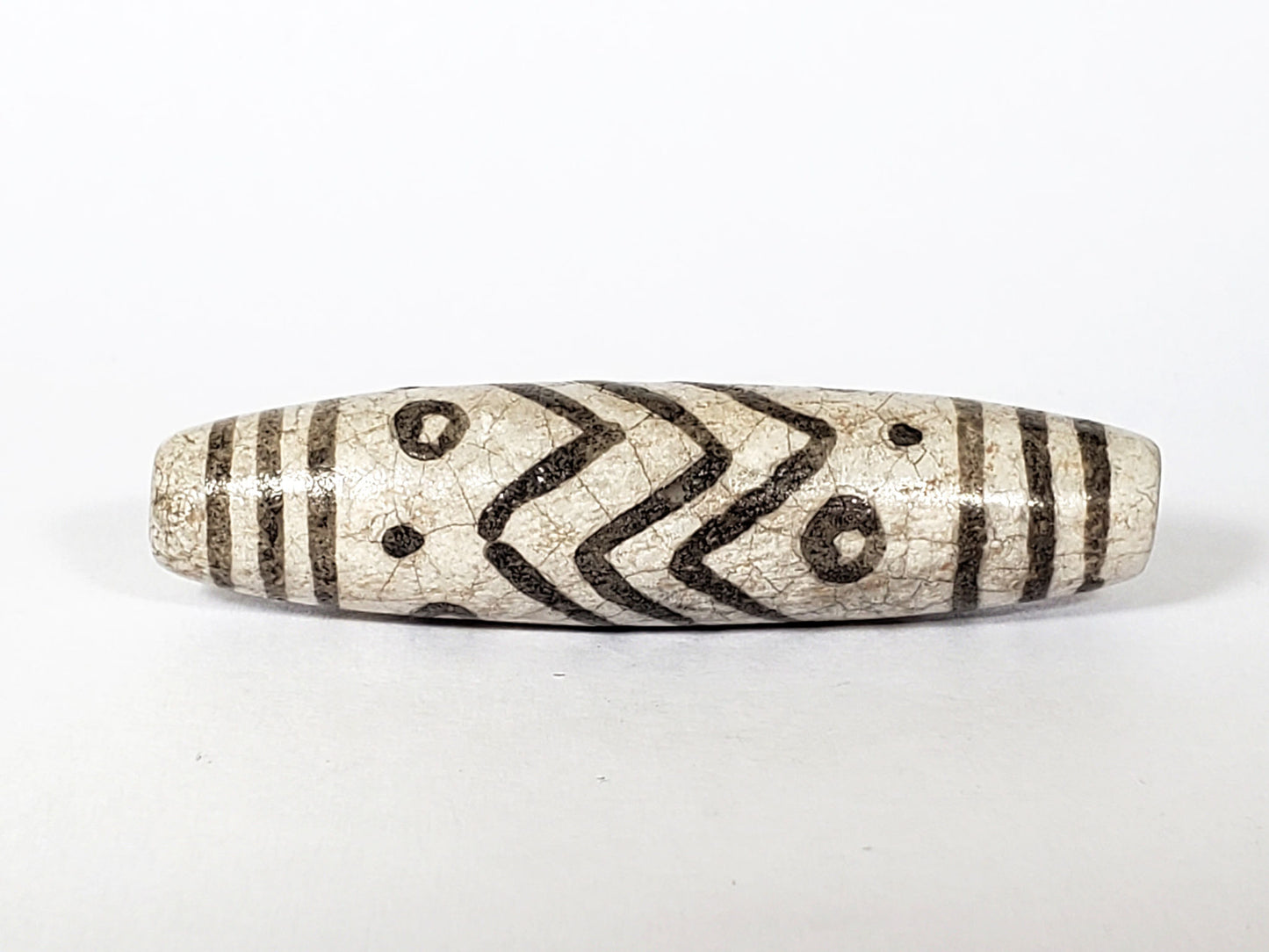 V-FA-062026-TESW face detail, chevrons and eyes, not an antique