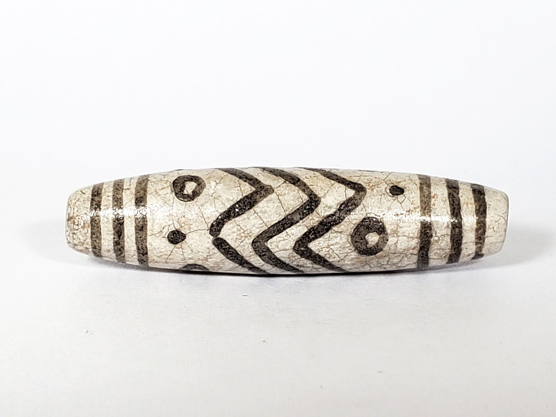V-FA-062026-TESW face detail, chevrons and eyes, not an antique