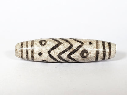 V-FA-062026-TESW face detail, chevrons and eyes, not an antique