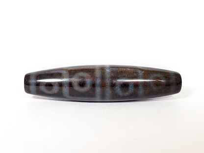 N-062126-12E-1 dzi bead, straight side profile, twelve ring eyes visible, unretouched