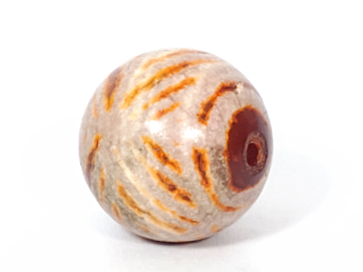 Ac-030623-DDIE carnelian dzi end, brown-red cinnabar bloodspot inclusions on terracotta-orange surface, unretouched
